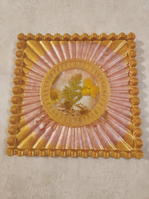 A Gold/Pink Jewelry Tray or Trivet